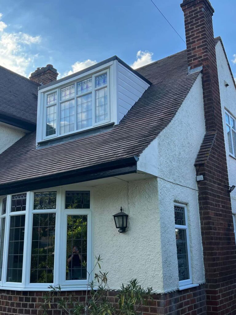 This is a photo of a dormer window which has just had some repairs carried out where the roof and the dormer meet. Works carried out by TRP Roofing Kingswood